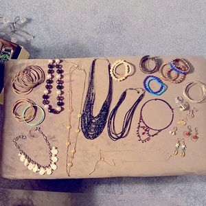Lot of costume jewelry- bracelets, necklaces, earrings, rings